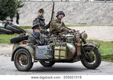 Gryfino Poland 23 september 2017: Historical reconstruction of the battle at Arnhem German soldiers riding on a motorcycle.