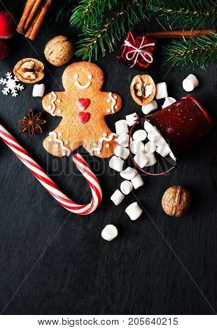 Christmas Card with Christmas gift Gingerman cookie fir tree branches xmas holiday decorations for your design