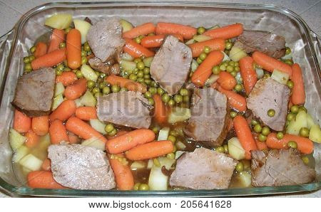 beef carrots peas potatoes casserole in glass pyrex