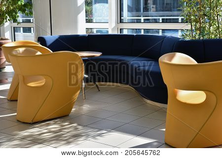 sofas and armchairs of a waiting room for travelers