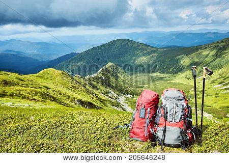 Backpacks in the mountains with views of the mountains.