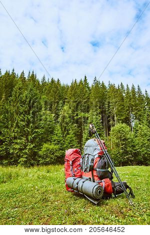 Backpacks in the mountains with views of the mountains.