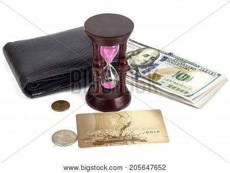 Dollars cents a plastic card a purse an hourglass on a white background
