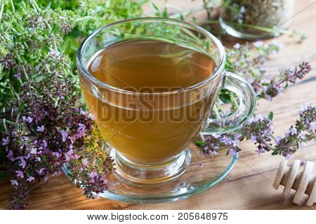 A Cup Of Breckland Thyme Tea On A Wooden Table