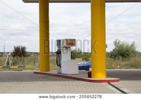 Empty petrol, diesel or gas yellow station at rural area
