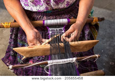 January 20 2015 San Pedro la Laguna Guatemala: hand of a Mayan woman making a traditional belt