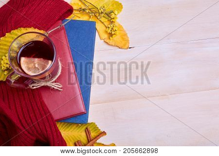 Cup of black tea on the yellow background. Close-up of autumn mood. Copy space.
