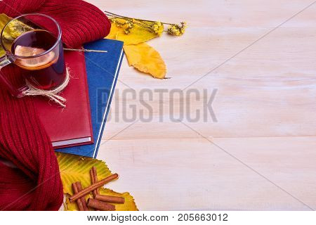 Cup of black tea on the yellow background. Close-up of autumn mood. Copy space.