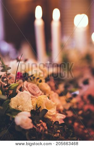 Elegant Restaurant Table with flowers and candles in studio