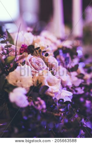 Elegant Restaurant Table with flowers and candles in studio