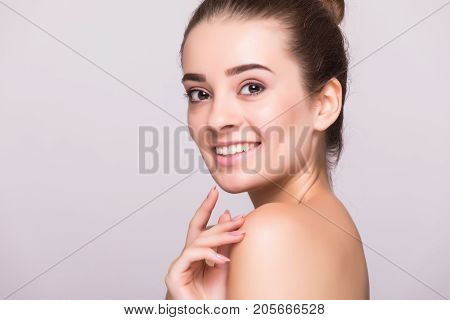 Beautiful Woman Face Close Up Hand Touching Face Studio On Gray