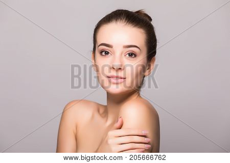 Beautiful Woman Face Close Up Hand Touching Face Studio On Gray