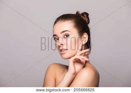 Beautiful Woman Face Close Up Hand Touching Face Studio On Gray