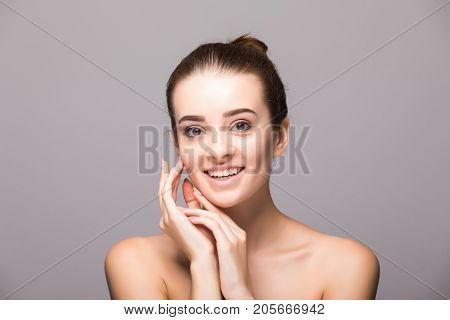 Beautiful Woman Face Close Up Hand Touching Face Studio On Gray
