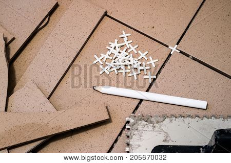 Tiling, Tile Trimming, Metering And Cutting. Repair Of The Floor. Sliced Gres Tiles.