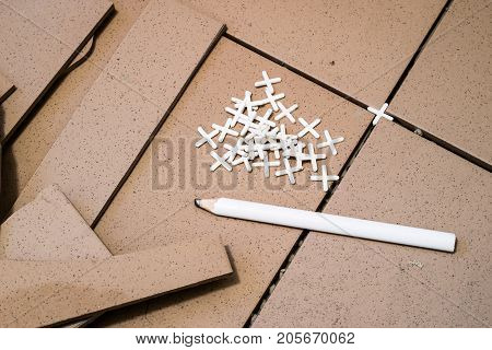 Tiling, Tile Trimming, Metering And Cutting. Repair Of The Floor. Sliced Gres Tiles.