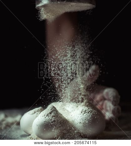 Male chef prepares a meal of flour
