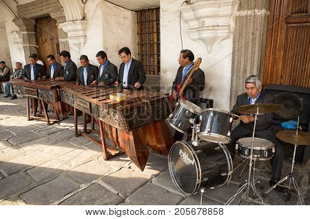 February 8 2015 Antigua Guatemala: men marimba band playing in front of a colonial building
