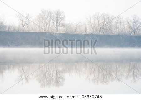 Morning on the river early morning reeds mist fog and water surface on the river