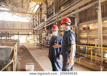 Padaeng industry Mae Sot Tak Thailand February20 2013 : Zinc mine. engineer consult about work.