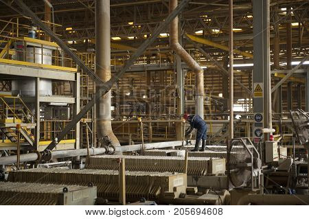 Padaeng industry Mae Sot Tak Thailand February20 2013 : Zinc mine Engineer control of machine in factory.