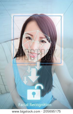 young woman is taking selfie for facial recognition concept