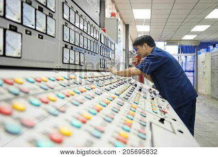 Padaeng industry Mae Sot Tak Thailand February20 2013 : Zinc mine. Engineer in control room.