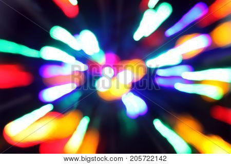 Multicolored highlights in motion on a black background. Lights. Night city.