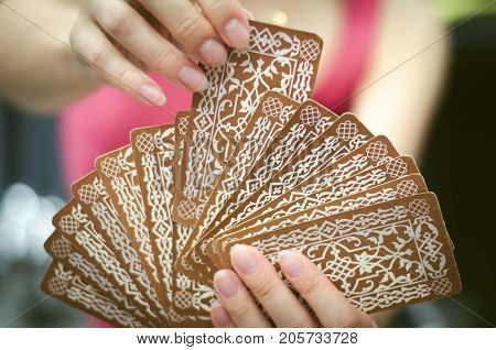 Fortune teller female hands and tarot cards. Divination concept.