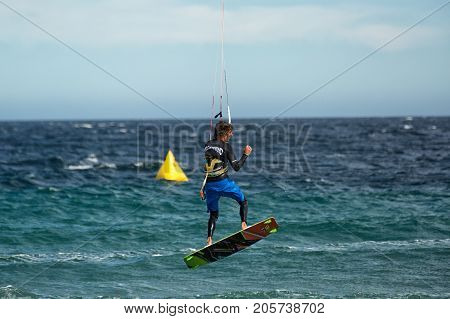 January 25 2014 Los Barriles Mexico: kiteboarder lifts off rough water at the 'Lord of the Wind' kite surf competition