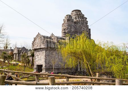 Pairi Daiza, Belgium - April 11, 2016: Old temple at Pairi Daiza, Belgium and people around