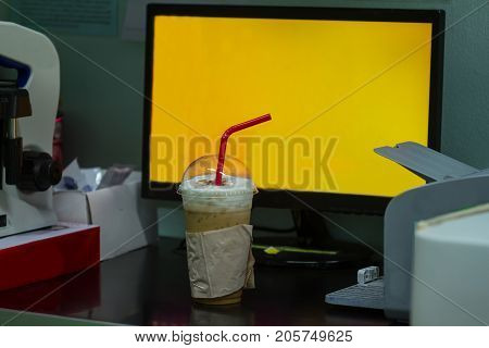 Iced Coffee On Table In Office Background