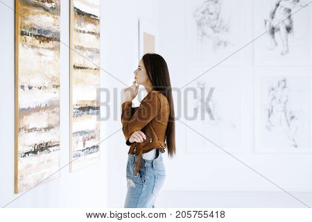 Young Woman Observing Painting