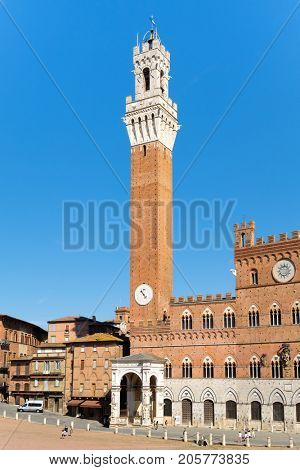 The Palazzo Publico at Piazza del Campo on the medieval city of Siena, Italy