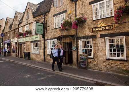 CIRENCESTER, ENGLAND - AUGUST 31, 2017:Old street in Cirencester, England, United Kingdom