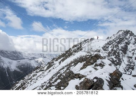 Picture of a man  standing on top of Little Arethusa in Kananaskis Country, Alberta,Canada.