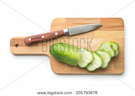 Fresh sliced cucumber isolated on white background. Cucumber on cutting board with knife.
