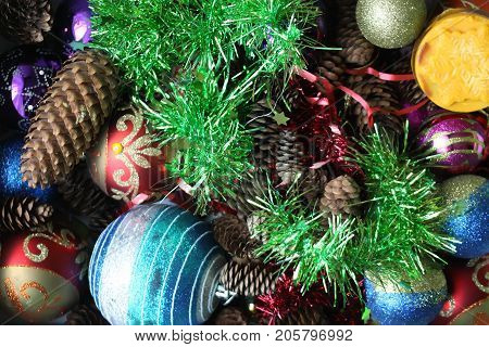 Burning Candle And Christmas Decorations With Dry Fir-tree Cones.