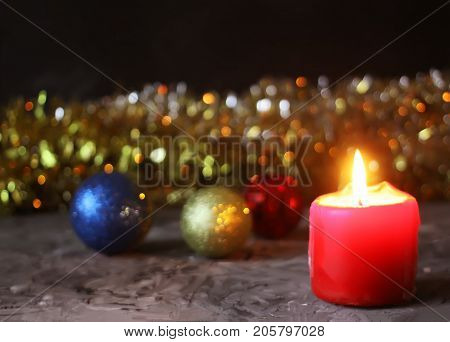 Burning Red Candle On Christmas Decoration Background.