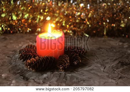 Burning Red Candle On Christmas Decoration Background.