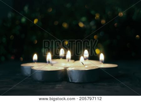 Burning Candles On Christmas Decoration Background. Festive Composition.