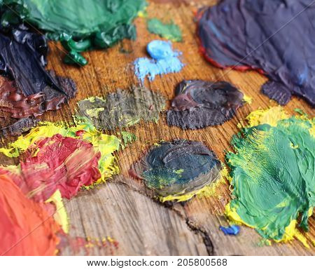 Mix Of Oil Paints On Handmade Wooden Palette.