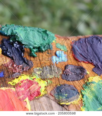 Mix of oil paints on handmade wooden palette.