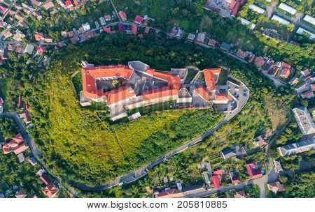 Aerial view of the Majestic Fortress - Palanok Castle towering above the city of Mukacheve, Ukraine. Top view, from above