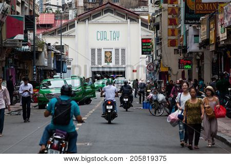 HO CHI MINH CITY (SAIGON), VIETNAM - JULY 2017 : Road traffic in Saigon, Vietnam. In the biggest city in Southern Vietnam there are more than 4 mil. motorbikes, the traffic is often congested