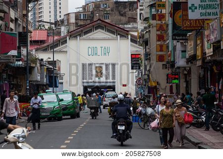 HO CHI MINH CITY (SAIGON), VIETNAM - JULY 2017 : Road traffic in Saigon, Vietnam. In the biggest city in Southern Vietnam there are more than 4 mil. motorbikes, the traffic is often congested