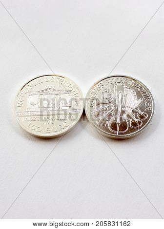 On a white background are silver coins of an investment silver from a mint.