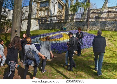 Istanbul Turkey - April 06 2016 Annual Spring Festival of Tulips new design Gulhane Park local people and tourists are getting rest making photos and enjoy good weather and spring slice of life editorial.