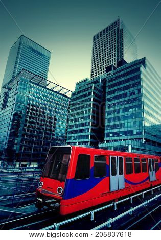 London, Canary Wharf modern skyscrapers with train