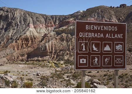 Quebrada Allane, Arica y Parinacota, Chile - August 24, 2017: Sign showing activities in the Allane River Valley on the Altiplano of northern Chile.